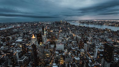 Stunning aerial view of New York City's skyscrapers and skyline at dusk, showcasing the urban landscape.